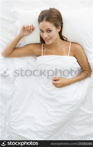 Woman lying in bed relaxing