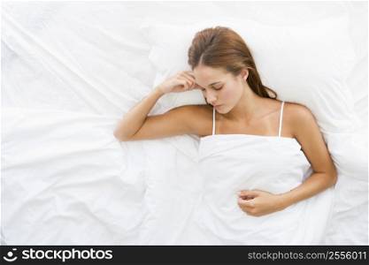 Woman lying in bed sleeping
