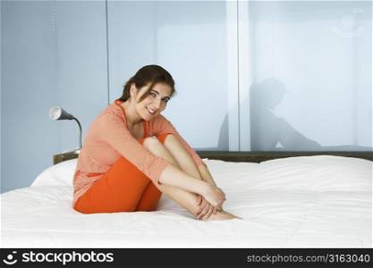 Woman lying on a bed