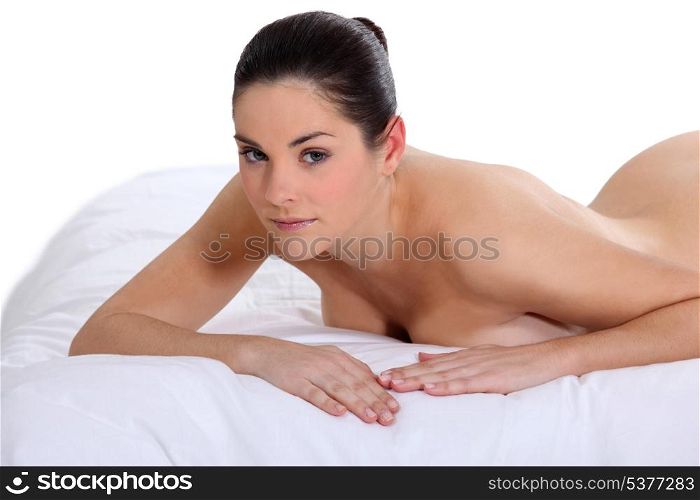 Woman lying on a mattress