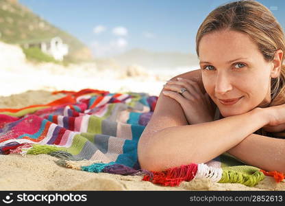 Woman lying on beach portrait