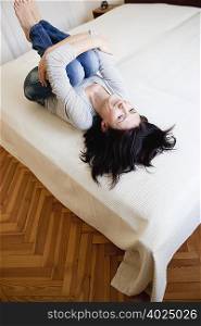 woman lying on bed
