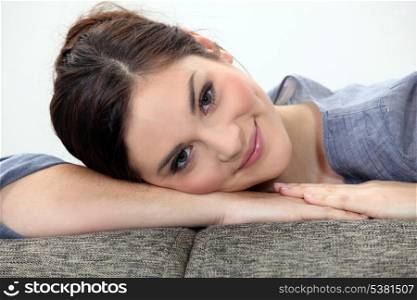 Woman lying on couch