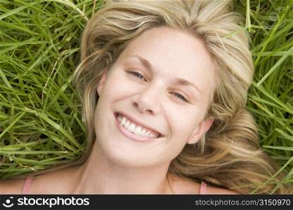 Woman lying on grass
