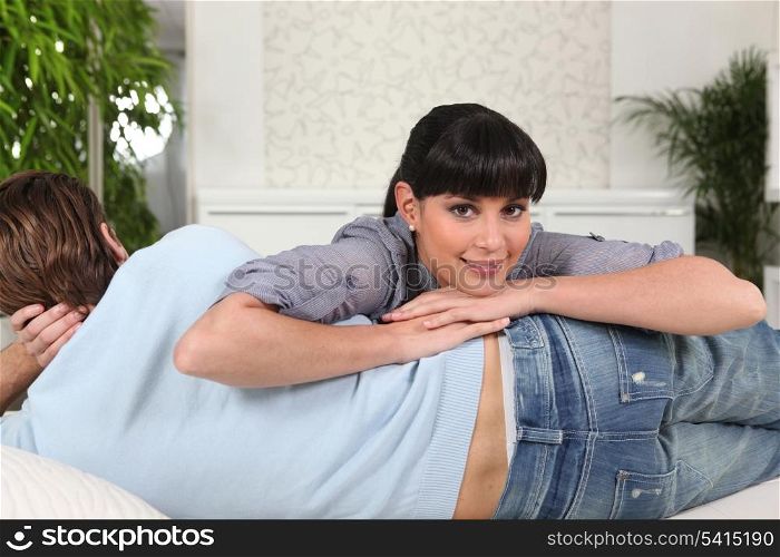 Woman lying on her boyfriend