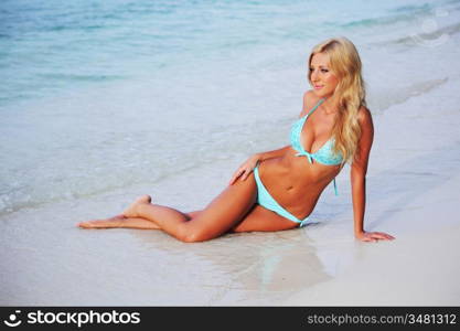 woman lying on the sand the ocean coast