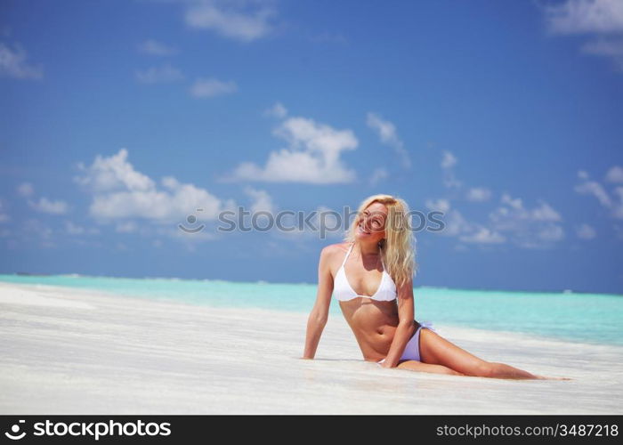 woman lying on the sand the ocean coast