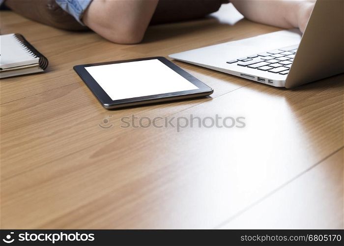 woman lying on wooden floor with computer notebook and tablet
