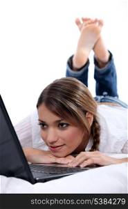woman lying with computer