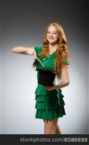 Woman magician wearing green dress