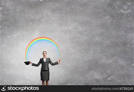 Woman magician with bowler hat. Attractive businesswoman with flute and bowler hat in hand
