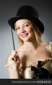 Woman magician with magic wand and hat