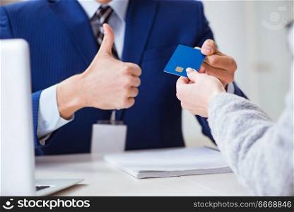 Woman makes payment with credit card