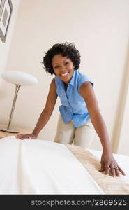 Woman making a bed
