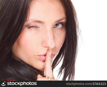 Woman making a keep quiet gesture putting her finger on mouth isolated