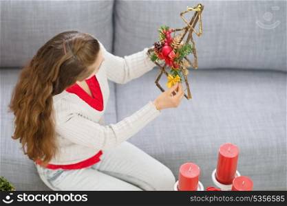 Woman making Christmas decorations