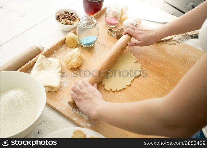 Woman making dough for cookies