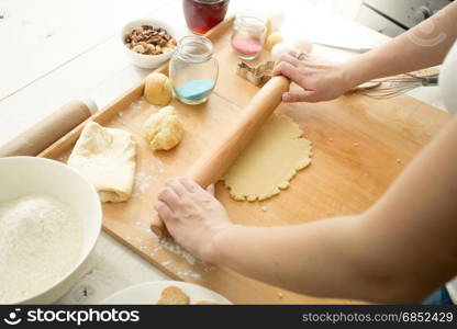 Woman making dough for cookies