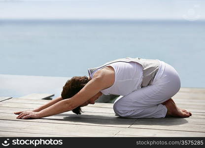 woman making exercises on the beach