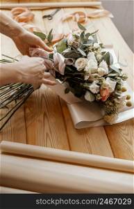 woman making floral arrangement