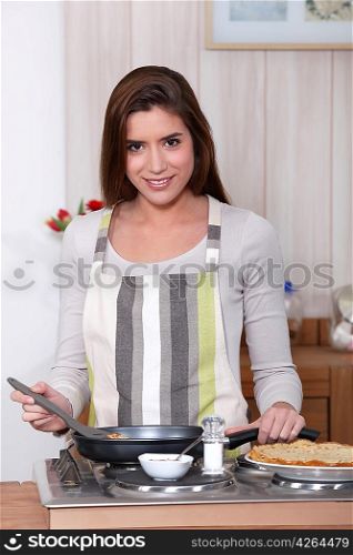 woman making pancakes