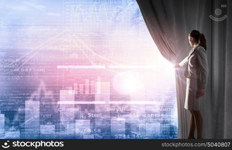 Woman making presentation. Young businesswoman opening curtain and presenting sales report