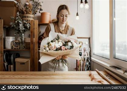 woman making pretty floral arrangement 2