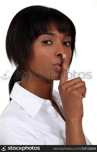Woman making shush gesture