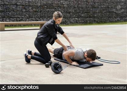 woman man exercising together outside