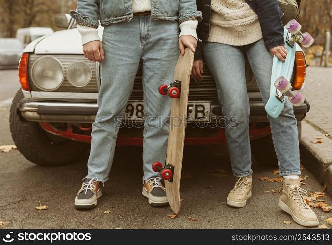 woman man holding their skateboards 2