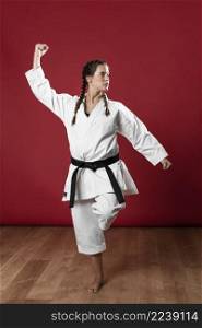woman martial arts uniform exercising karate