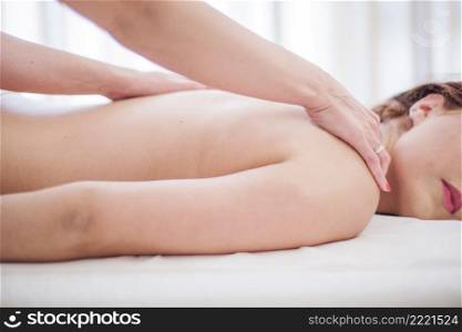 woman massaging girl table