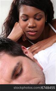 Woman massaging her husband