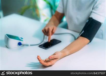 Woman Measuring Blood Pressure at Home . Woman Measuring Blood Pressure at Home