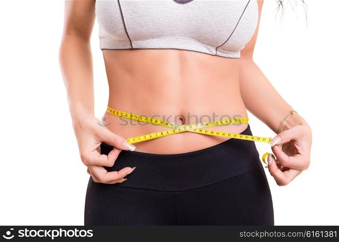 Woman measuring her body - fitness concept