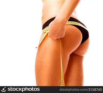 Woman measuring her body. Isolated over white.