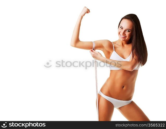 Woman measuring her muscles on white background