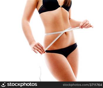 Woman measuring her torso. Isolated over white.