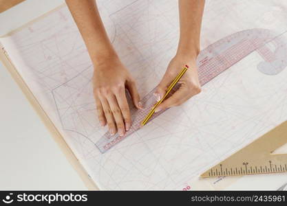 woman measuring with ruler close up