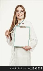 Woman medical doctor with stethoscope, clipboard and pen wearing white coat isolated. Professional health care advertisement.. Woman doctor with stethoscope, clipboard and pen.