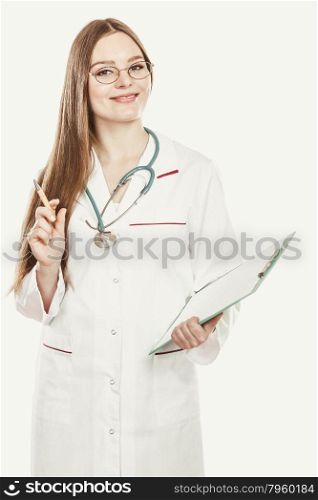 Woman medical doctor with stethoscope, clipboard and pen wearing white coat isolated. Professional health care.