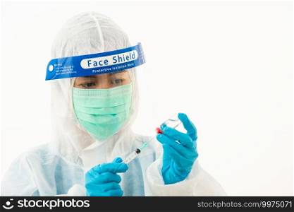 Woman medical scientist in PPE uniform wearing a face mask protective and plastic face shield holding for vaccine and syringe quarantine Coronavirus outbreak  COVID-19  isolated on white background