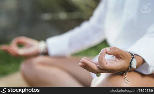 Woman meditating, balancing energy. Hands in mudra position.. Self-Healing Mindfulness Meditation