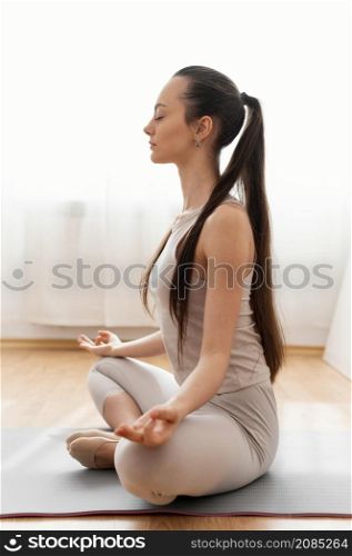 woman meditating home