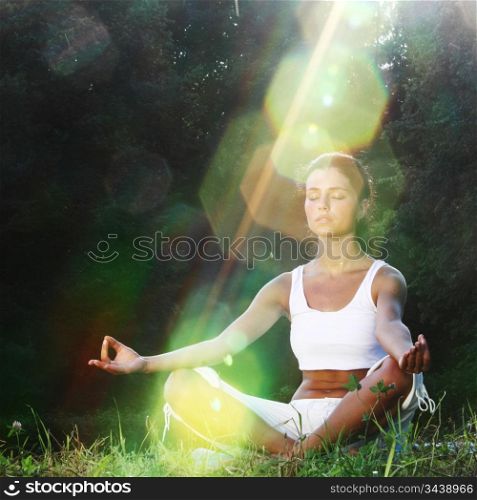 Woman meditating in a field