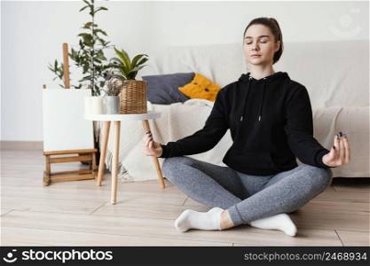woman meditating indoor 10