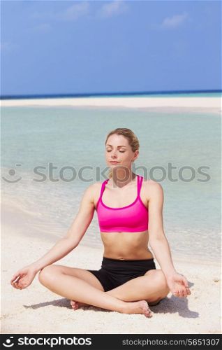 Woman Meditating On Beautiful Beach
