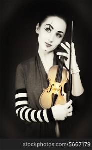 woman mime playing the violin. vintage