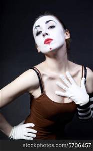 woman mime with theatrical makeup on black background
