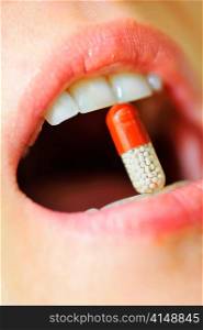 woman mouth with lips and medicine pill